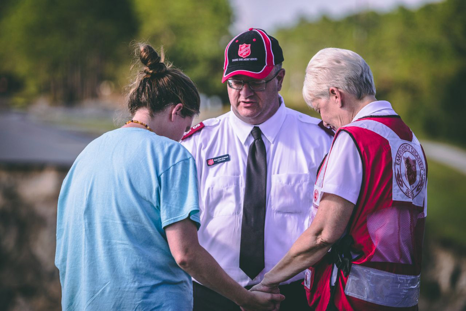 Three people praying together